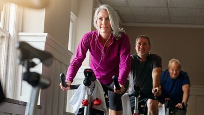 Woman cycling in a cycle class