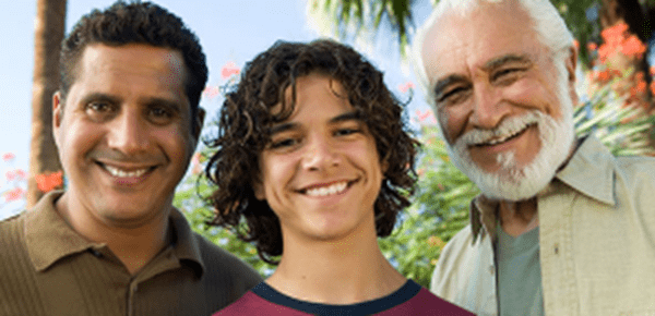 Three men smiling.