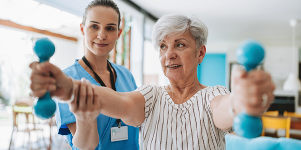 Medical staff wrapping patient's leg