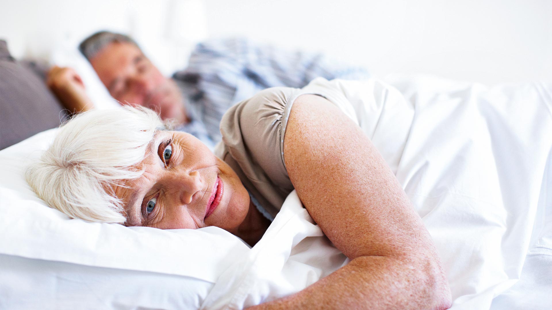 woman laying down in bed